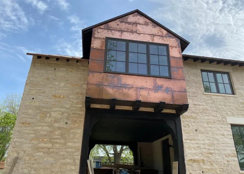 Copper metal panel facade on a stone building for Skylight Installation in Los Altos Hills